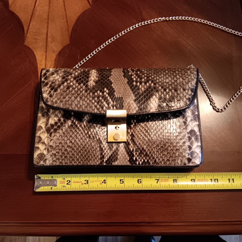 Vintage snakeskin clutch purse unique. Has A Key To Lock Purse.